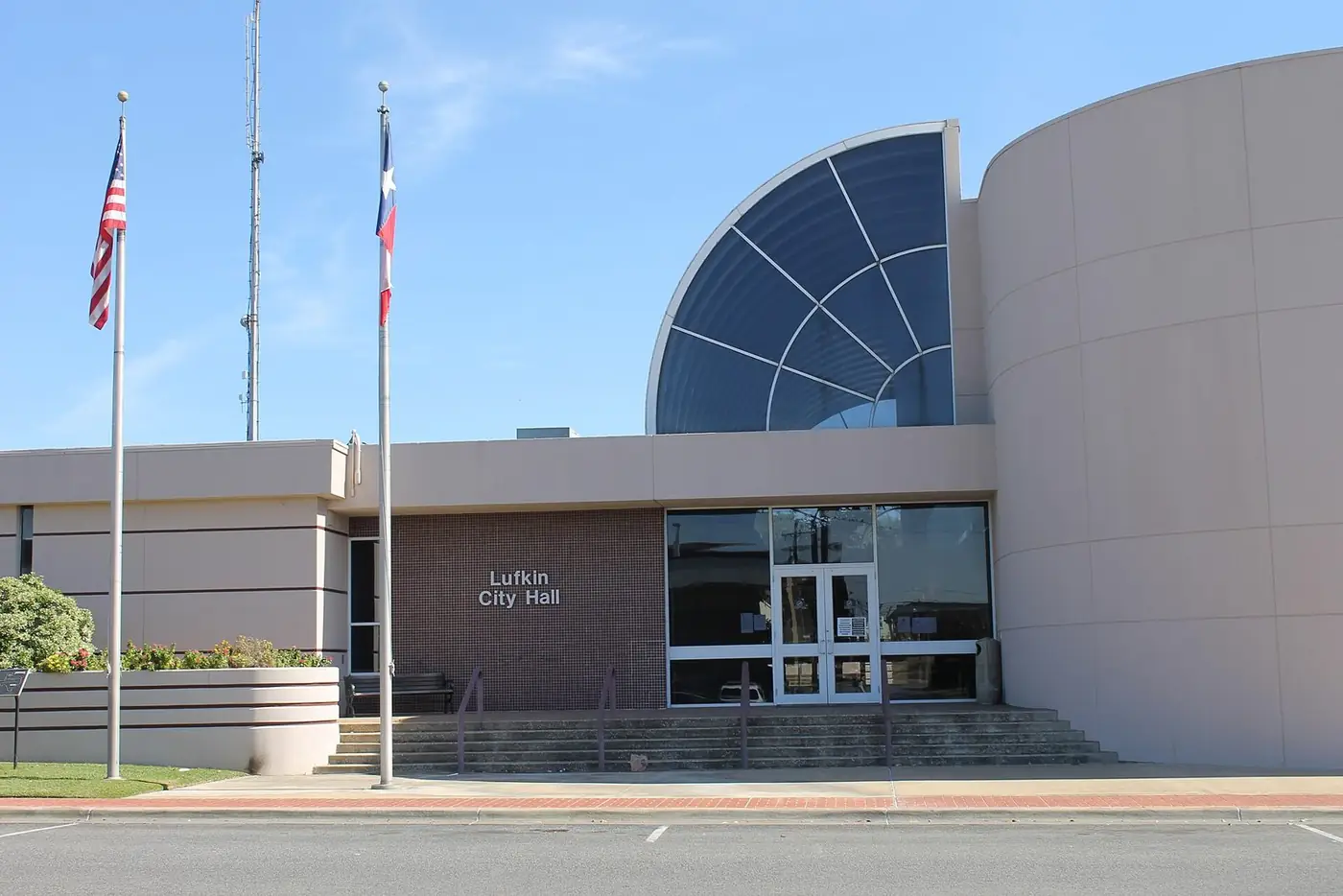 Lufkin City Hall with a curved glass entrance